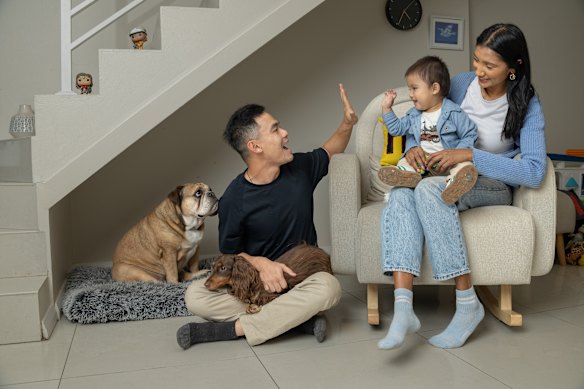 Reshmi, pictured with her husband Tommy, one-year-old son, Adrian, and their dogs – dachshund Maple and bulldog Bronx – would like to give Adrian a sibling. The cost of having a child and being able to give him the lifestyle the couple want for him, and the mental load, is holding them back.