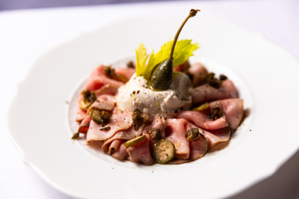 Vitello anguillato, a lush, creamy smoked eel mayonnaise over paper-thin slices of poached veal girello.
