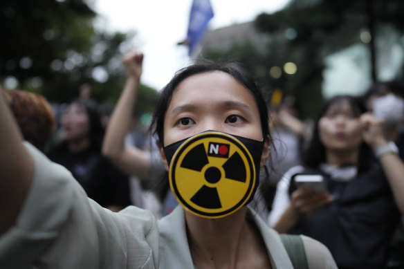 In Seoul, South Korea, a member of environmental civic group shouts during a rally against the Japanese government’s decision to release treated radioactive water into the sea from the damaged Fukushima nuclear power plant.