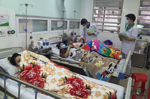 Victims of the karaoke parlor fire being treated in a hospital in Thuan An.