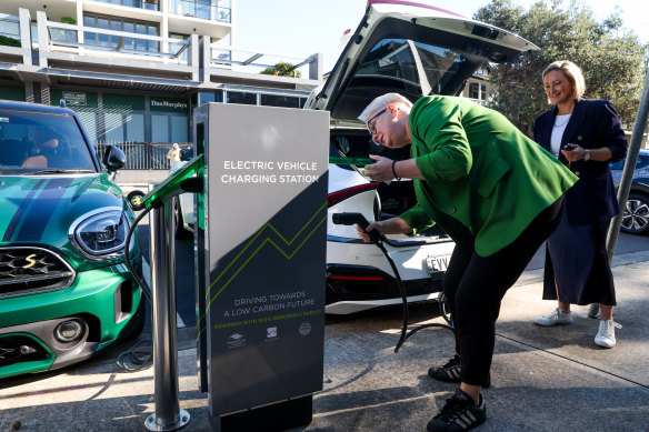Minister for Climate Change, Energy and Environment Penny Sharpe charging her own electric vehicle in Coogee. Randwick City Council will get 83 roadside EV chargers. 