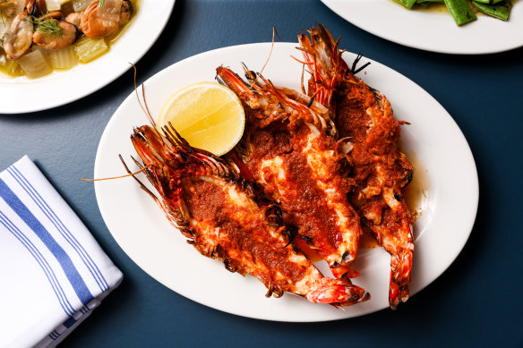 Skull Island prawns, split and scorchy from the grill, with 𝄒nduja  butter.
