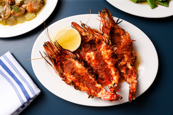 Skull Island prawns, split and scorchy from the grill, with 𝄒nduja butter.