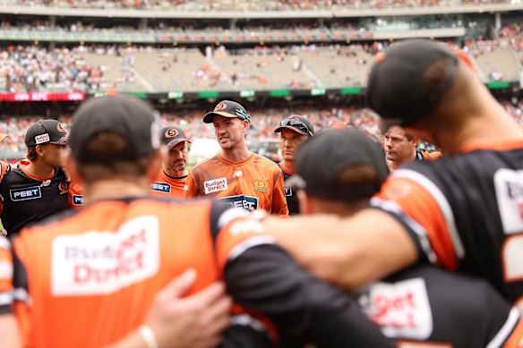 Turners address his team before the match.