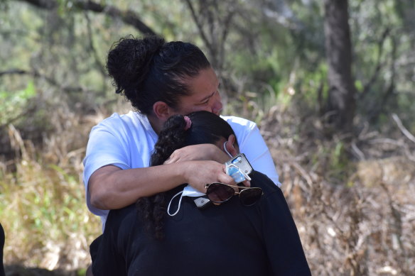 Lesley Fernando comforts Narelle Copeland. 