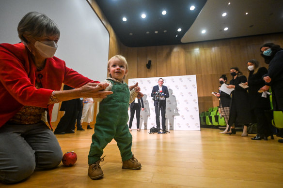 Premier Daniel Andrews addresses the media on Thursday, with 13-month-old Angus, who attended a respiratory clinic this year with RSV.