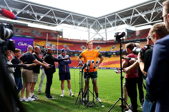 Harry Wilson addresses a large media contingent at Suncorp.