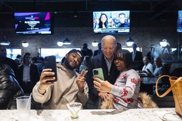 President Joe Biden, centre, with patrons at They Say restaurant during a campaign stop  in Harper Woods, Michigan.