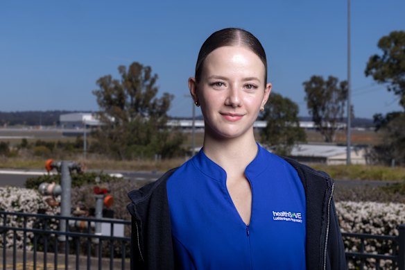Sienna Hayes-Davis at the Luddenham shops, which overlook the runway and cargo terminal.