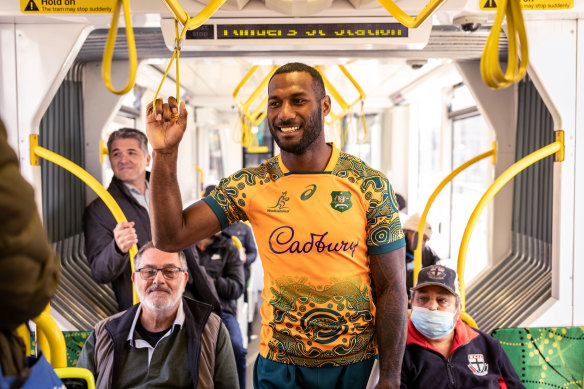 Wallabies winger Suliasi Vunivalu rides the tram on Wednesday.