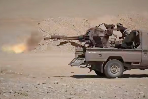 A Houthi media image of Houthi fighters firing a weapon mounted on a ute during combat with Saudi-backed forces in eastern Jawf, Yemen.