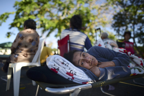 Maribel Rivera Silva, 58, rests outside a shelter after an earthquake in Guanica, Puerto Rico.