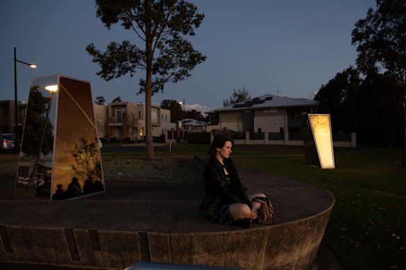 Madeline Lambert watches the sunset at Ironbark Lake in The Ponds.