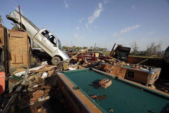 A pickup truck rests on top of a restaurant cooler at Chuck’s Dairy Cafe in Rolling Fork, Mississippi.