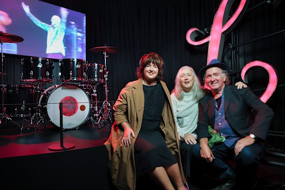 Rob Hirst’s daughter Lex, wife Leslie and Midnight Oil bandmate Jim Moginie with the drummer’s rescued kit.