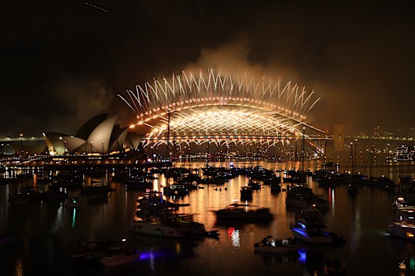 Golden fireworks spray from the Sydney Harbour Bridge.