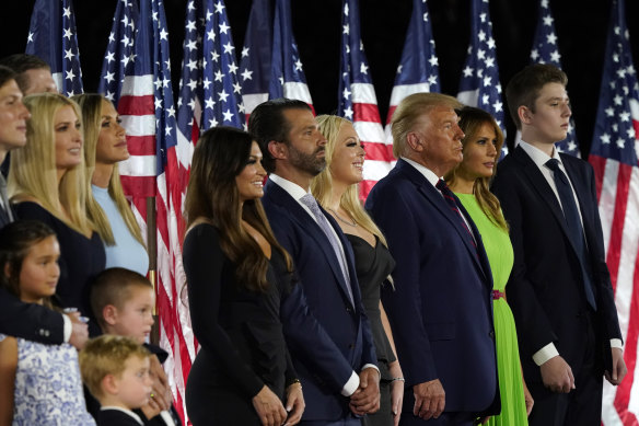 It was a family affair: (from left) Jared Kushner, Ivanka Trump and their children, Eric and Lara Trump, Kimberly Guilfoyle and Donald Trump jnr, Tiffany Trump, and President Donald Trump, first lady Melania Trump and their son Barron on stage at the White House. 