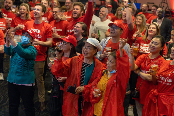 ALP supporters cheer after the ABC projected a Labor election win on November 26.