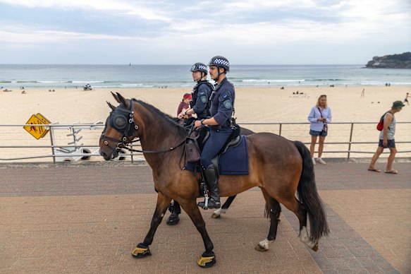Mounted police patrol Bondi Beach on Sunday afternoon.