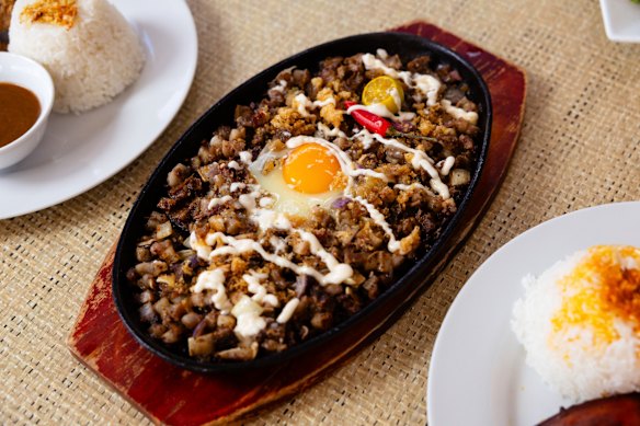 Sizzling sisig (boiled and deep-fried pig’s head and belly).