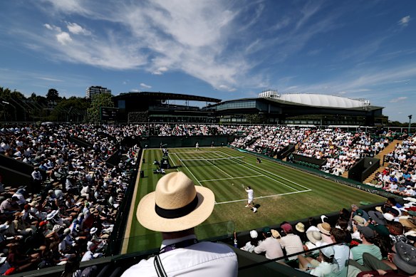 Fans taking in the sun on court three at the All England club.