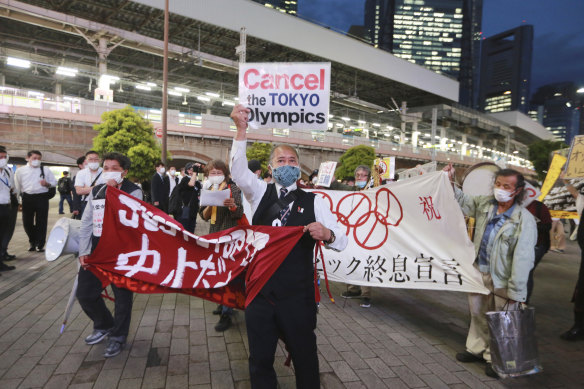 Demonstrators in Tokyo protest against the Games being held in Japan.