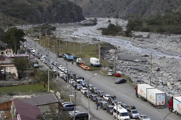 Cars queuing toward the border crossing at Verkhny Lars between Russia and Georgia, leaving Chmi, North Ossetia - Alania Republic, in Russia.