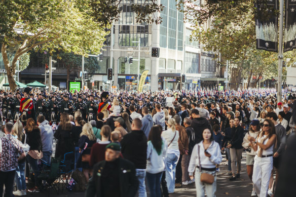 Crowds gather to view the parade. 