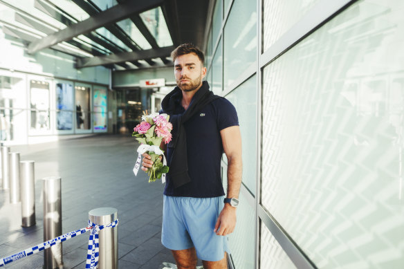 Valentine Cuny drops off flowers as tribute to those who passed away during the incident.