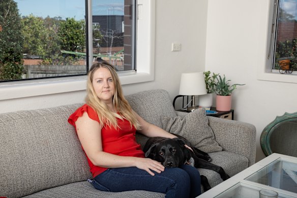 Gina Chatellier and her dog Maggie at their rental property in the Five Dock area.