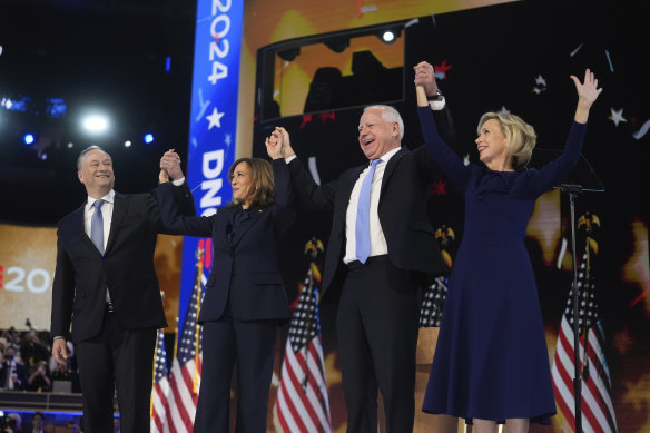 Democratic presidential candidate, Vice President Kamala Harris with second gentleman Douglas Emhoff, left, and Democratic vice presidential candidate Minnesota Governor Tim Walz with his wife Gwen Walz celebrate.