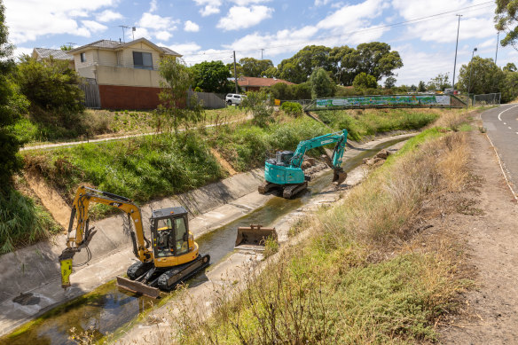 Diggers ripping up the concrete along Moonee Ponds Creek last week.
