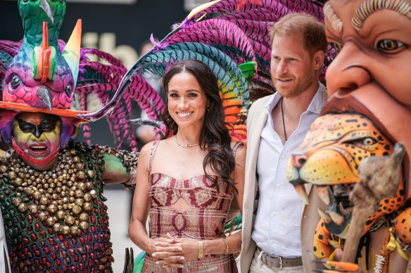 The Duke and Duchess of Sussex pose for a photo at Centro Nacional de las Artes Delia Zapata during a visit to Colombia.