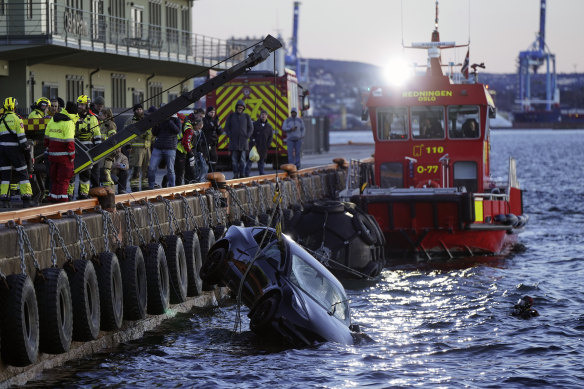 The car is retrieved after the occupants were rescued by the sauna operator and his clients.