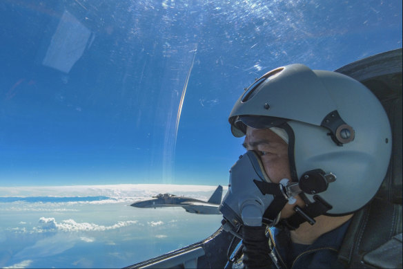 A Chinese military pilot taking part in combat training excercises around Taiwan on Sunday.