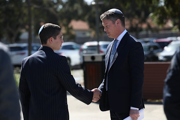 A Mount Scopus student thanks Premier Ben Carroll after his speech.