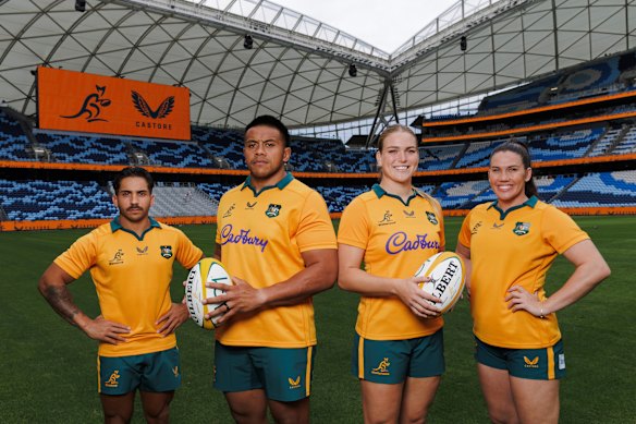 Allan Alaalatoa (second from left) poses with Maurice Longbottom, Kaitlan Leaney and Charlotte Caslick at Allianz Stadium in their new Castore-made jerseys.

