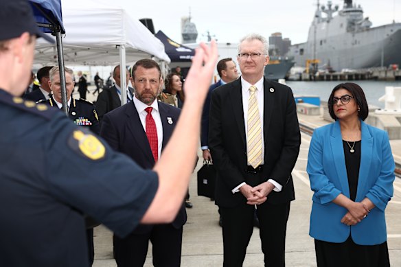 Tony Burke (second from right) with the US and UK secretaries of state at Garden Island this afternoon.