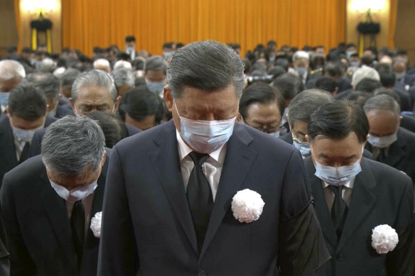 Chinese President Xi Jinping leads other officials in bowing at the official memorial service of the late former Chinese President Jiang Zemin.