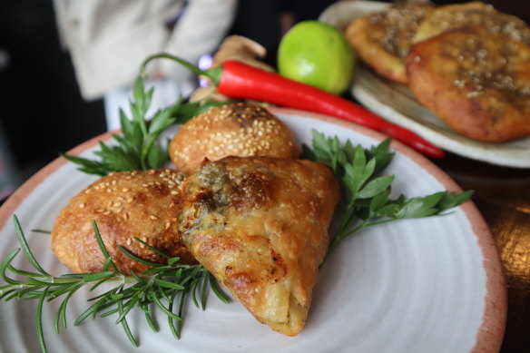 Palestinian pastries including spinach and cheese fatayer and manakish zaatar (flatbread).