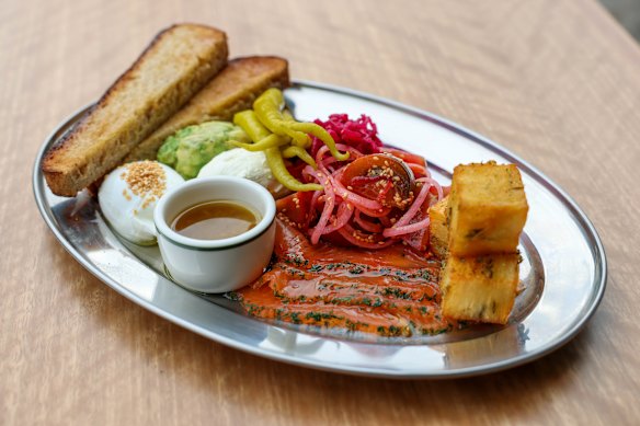 The breakfast plate includes salmon gravlax, guacamole, potato latkes and more.