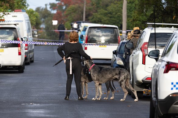 Neighbours and onlookers outside the police cordon on Tuesday morning.
