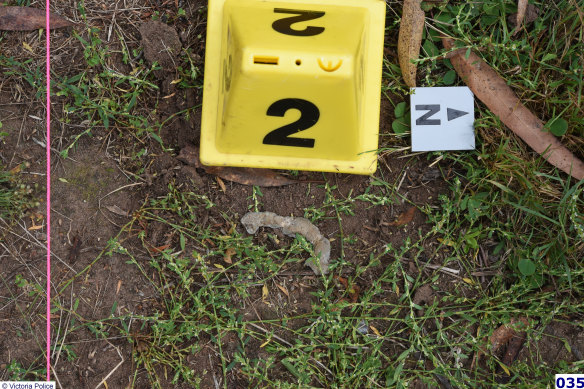 A police crime scene photograph of a lead fragment at Bucks Camp.