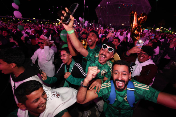 Fans celebrate as Saudi Arabia is announced as the host nation for the World Cup in 2034.