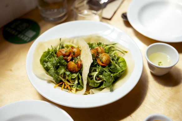 The Lucky Kwong steamed savoury pancakes with seared Tasmanian scallops, fried egg, vegetables, South Eveleigh native bush mint, caramel-tamari and XO.