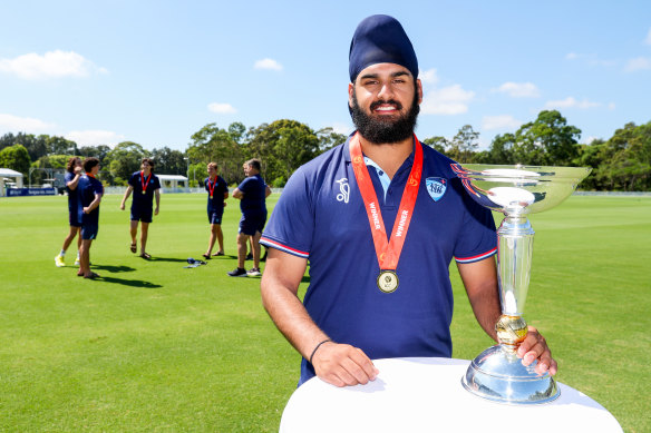 Harjas Singh with the under-19 World Cup and wearing his winner’s medal at Cricket NSW headquarters.