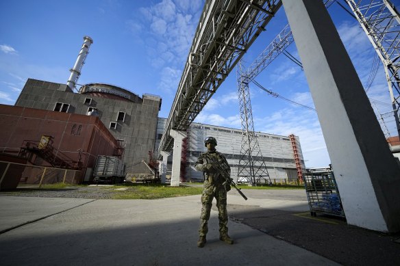 A Russian serviceman stands guard at the Zaporizhzhia Nuclear Power Station.