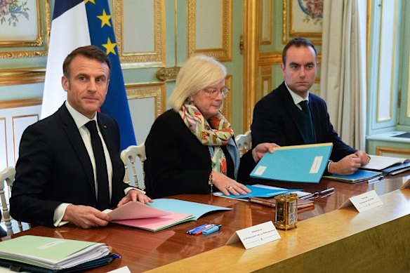 French President Emmanuel Macron, left, with Health Minister Catherine Vautrin.