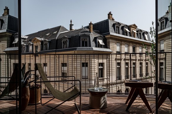 Balcony views dominated by stately Haussman-style buildings.