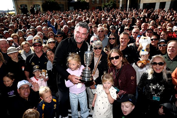 New Zealand golfer Ryan Fox holds the Claret Jug as he stands with his wife Anneke Ryff and their two daughters Isabel and Margot during a public reception in Takutai Square. He will get a huge reception at this year’s Australian Open. 
